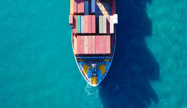 istock Large container ship at sea - Top down Aerial Image 868184910