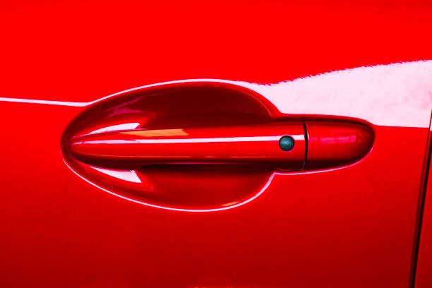istock Car door handle red color for customers. Using wallpaper or background for transport and automotive image. 868185236