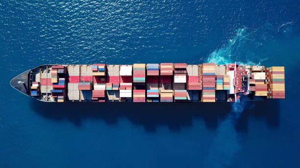 istock Large container ship at sea - Top down Aerial Image 868185396