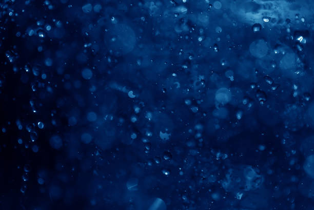 istock blue spray fountain at night 868187576