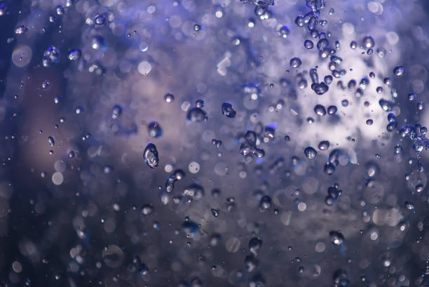 istock Multicolored spray fountain at night 868187636