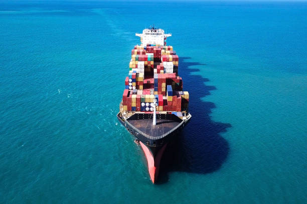 istock Large container ship at sea - Top down Aerial Image 868188692