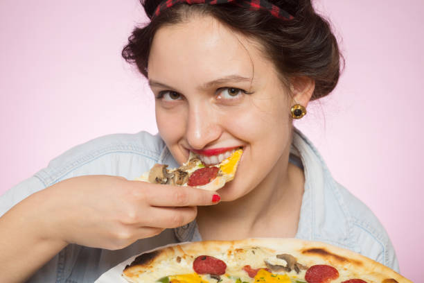 istock woman with pizza 868188850