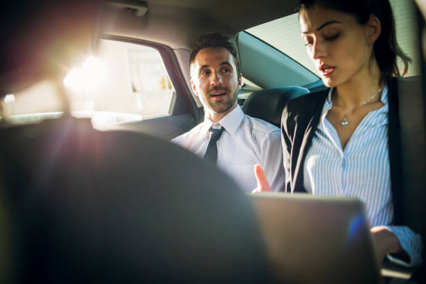 istock business people working in the car 868191888
