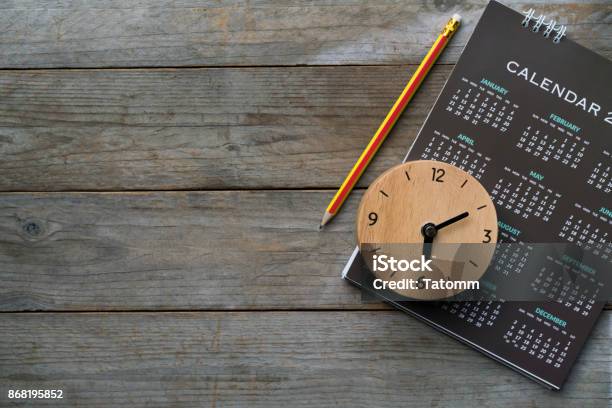 Close Up Of Clock Calendar And Pencil On The Table Planning For Business Meeting Or Travel Planning Concept Stock Photo - Download Image Now