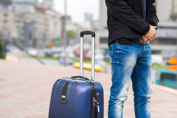 istock Man with luggage in the city 868196400