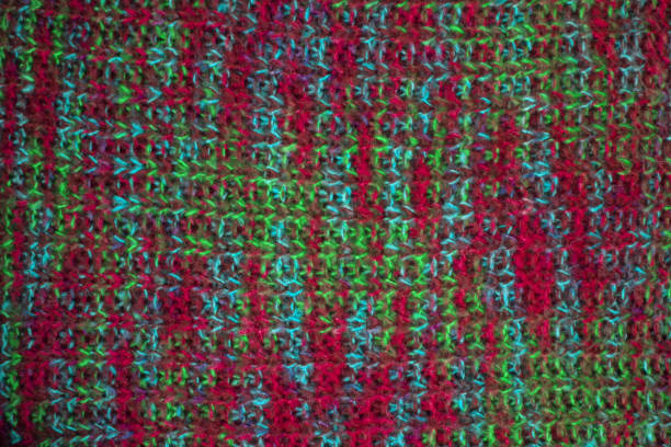 istock Knitted fabric texture. Closeup view of multicolored fabric jersey. Multicolor abstract background and texture for designers. Colorful cloth background. Macro view of knitted fabric fibers. 868196888