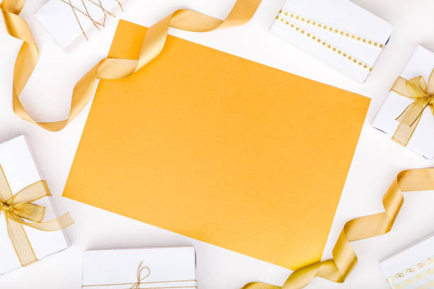 istock golden gift boxes on white background with copy space for text. holiday and celebration concept. wedding, marriage or birthday composition. flat lay, top view 868200342