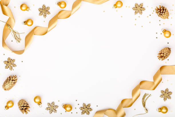 christmas or new year frame composition. christmas decorations in gold colors on white background with empty copy space for text. holiday and celebration concept for postcard or invitation. top view