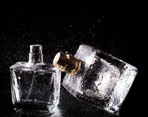 istock Three bottles of perfumes over black background 868204932