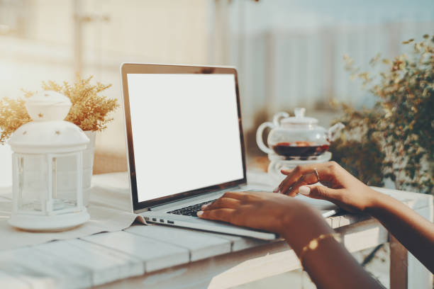 istock Hands of black girl using laptop with empty screen template 868206236