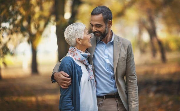 istock Mid aged couple in a park 868210004