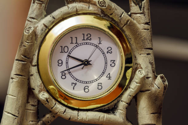 Clock in wooden frame made of birch.
