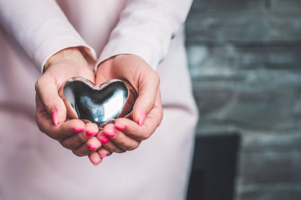 istock Woman holds in her hand the heart 868217680