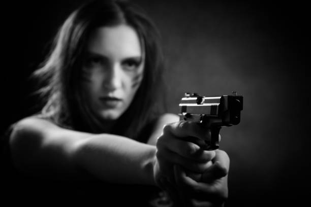 istock woman with gun 868220934