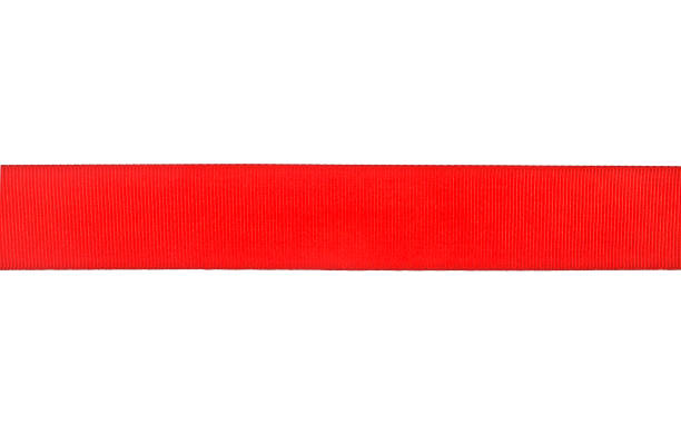 istock Red ribbon isolated on a white background, closeup 868221370