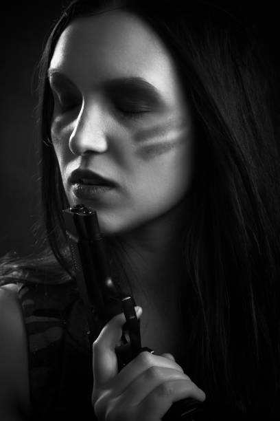 istock woman with gun 868221666