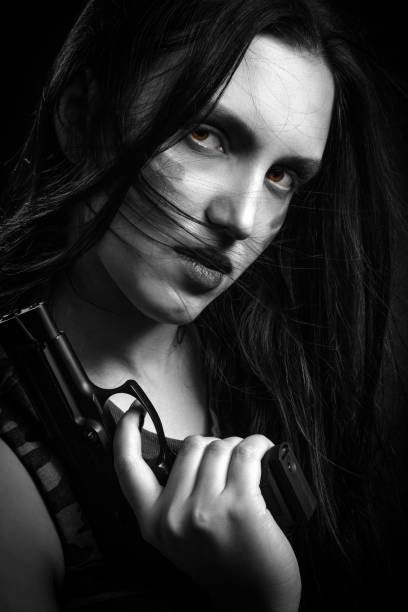istock woman with gun 868221674
