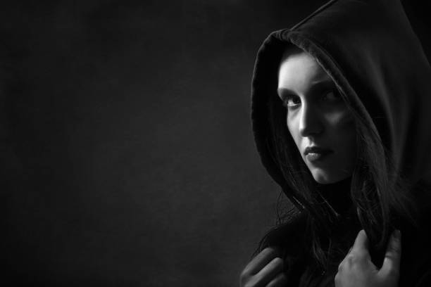 istock serious woman in hood 868224072
