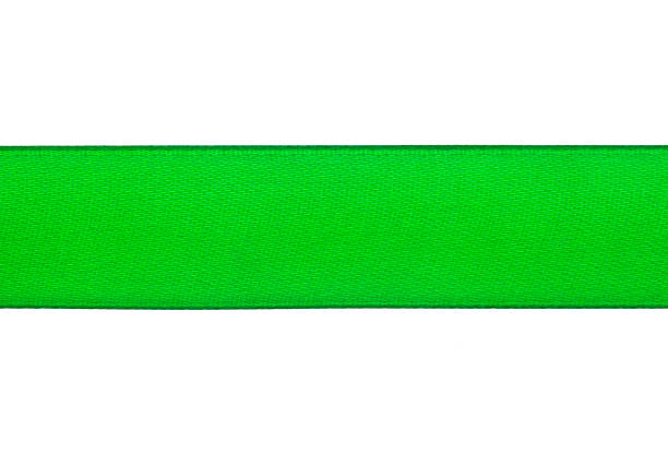 istock Horizontal green satin ribbon on white background 868224074