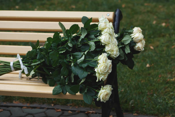 istock bunch of white roses on a bench 868225072