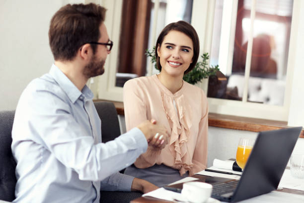 istock Two Businesspeople Meeting For Lunch In Restaurant 868228276