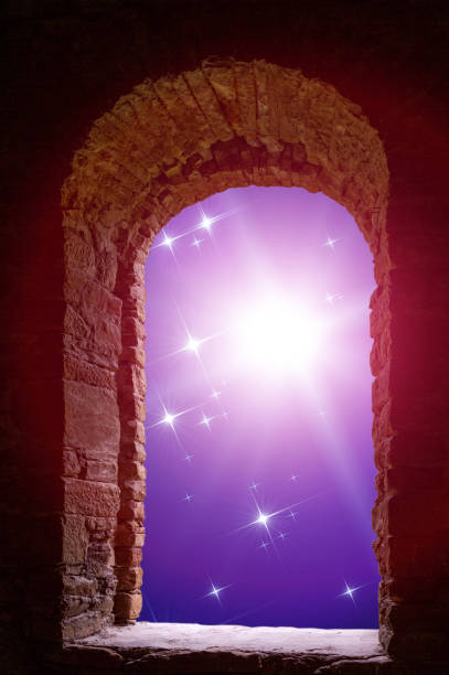 istock The sky with stars and some supernova star visible through an old ancient stone window. 868231150