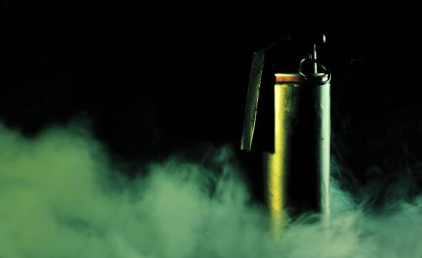 istock Smoke grenade on dark background with smoke 868231372