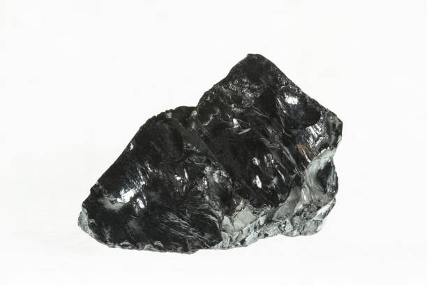 istock Black coal mine close-up with large depth of field. Anthracite coal bar isolated on white background 868243016