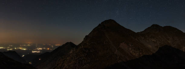 istock Mountains and stars above at night 868246574