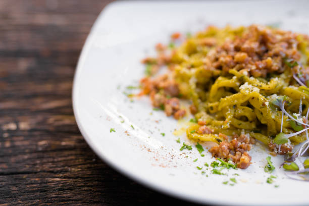 Tagliolini Pasta With Pesto and Sausage Horizontal Shot