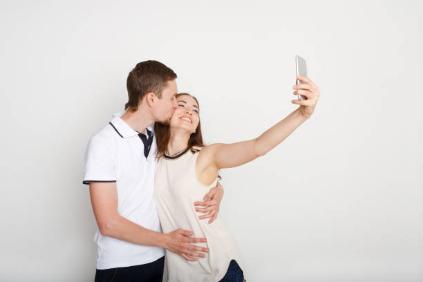 istock Happy couple taking selfie on smartphone 868257764