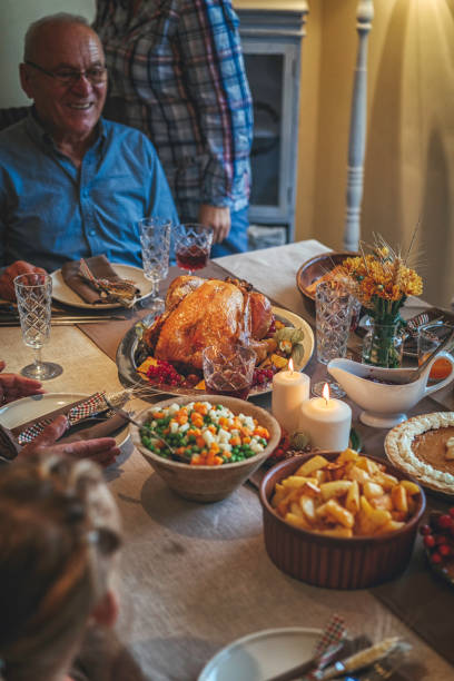 istock Family Having Traditional Holiday Stuffed Turkey Dinner 868267984