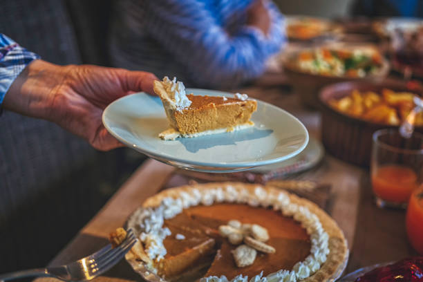 istock Family Having Traditional Holiday Stuffed Turkey Dinner 868267994
