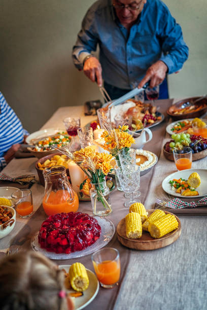 istock Family Having Traditional Holiday Stuffed Turkey Dinner 868268000