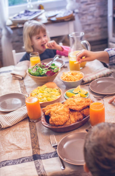 istock Eating Wiener Schnitzel with Potatoes and Green Salad 868268408