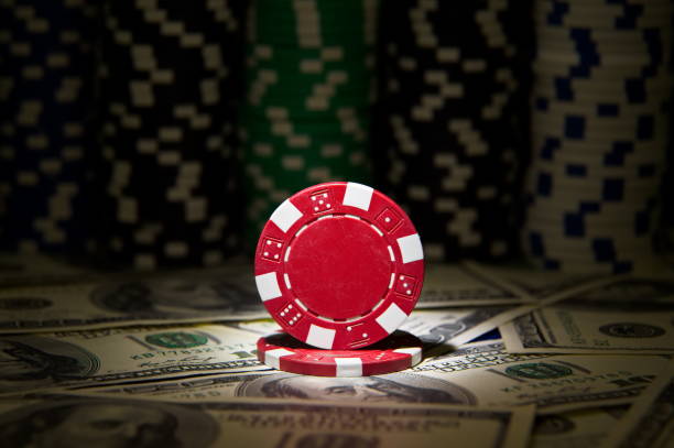 istock Red poker Chip at dollar background 868272684