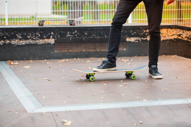 istock Young skate boy doing trick in skating park outdoors. Sport concept. 868274810