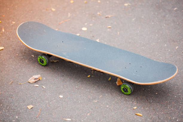 istock Modern skateboard lying on the road outdoors. 868274878