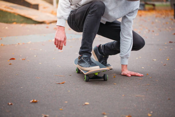 istock Young skate boy doing trick in skating park outdoors. Sport concept. 868274958