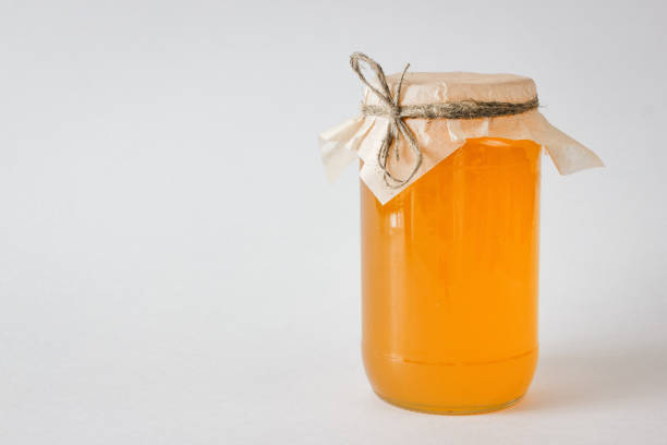 istock Honey in a jar. Isolated on a white background. 868275086
