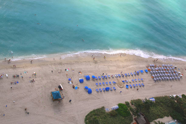 istock Relaxing beach chairs and umbrellas 868281204