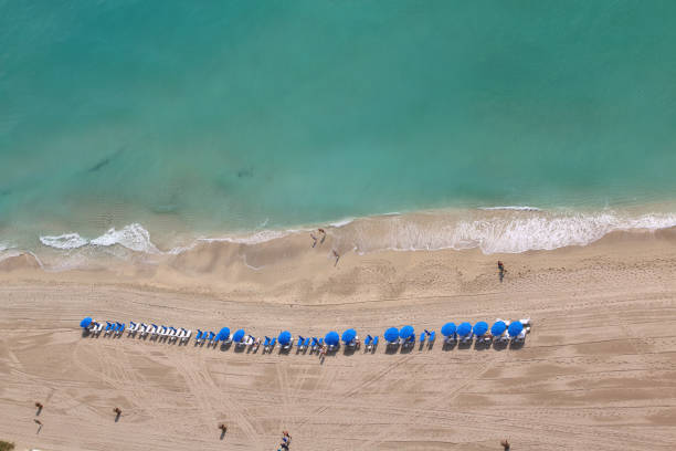 istock Relaxing beach chairs and umbrellas 868281228