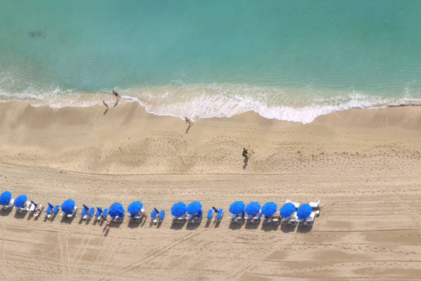 istock Relaxing beach chairs and umbrellas 868281262