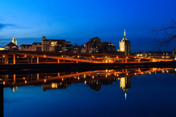 istock Albany NY skyline at night reflections off the Hudson River 868281760