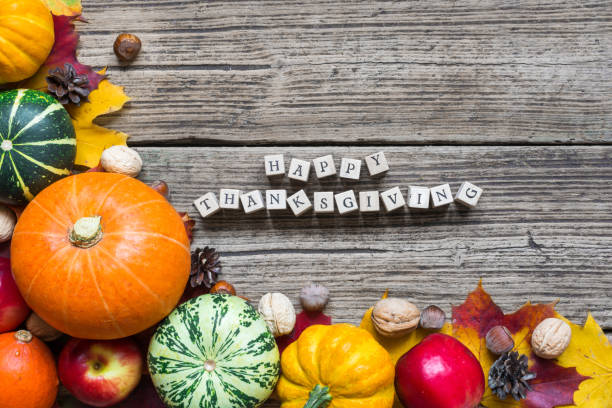 istock happy thanksgiving inscription with fall fruit and vegetables with maple leaves 868282276