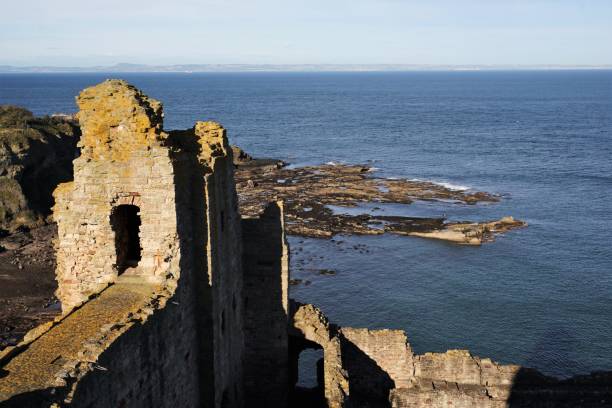 Tantallon Castle and Coastal rocks North Berwick, East Lothian, Scotland - October 27, 2017: View looking down past the ramparts of Tantallon Castle towards the rocky coastline of the Firth of Forth. The county of Fife can be seen on the horizon. north berwick scotland east lothian castle scotland stock pictures, royalty-free photos & images