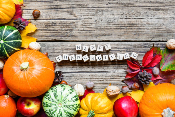 istock happy thanksgiving inscription with fall fruit and vegetables with maple leaves 868282472