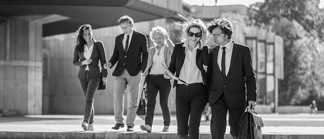 Business people walking in the street.