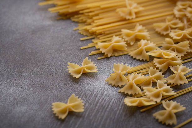 istock Composition of uncooked italian pasta. 868289178